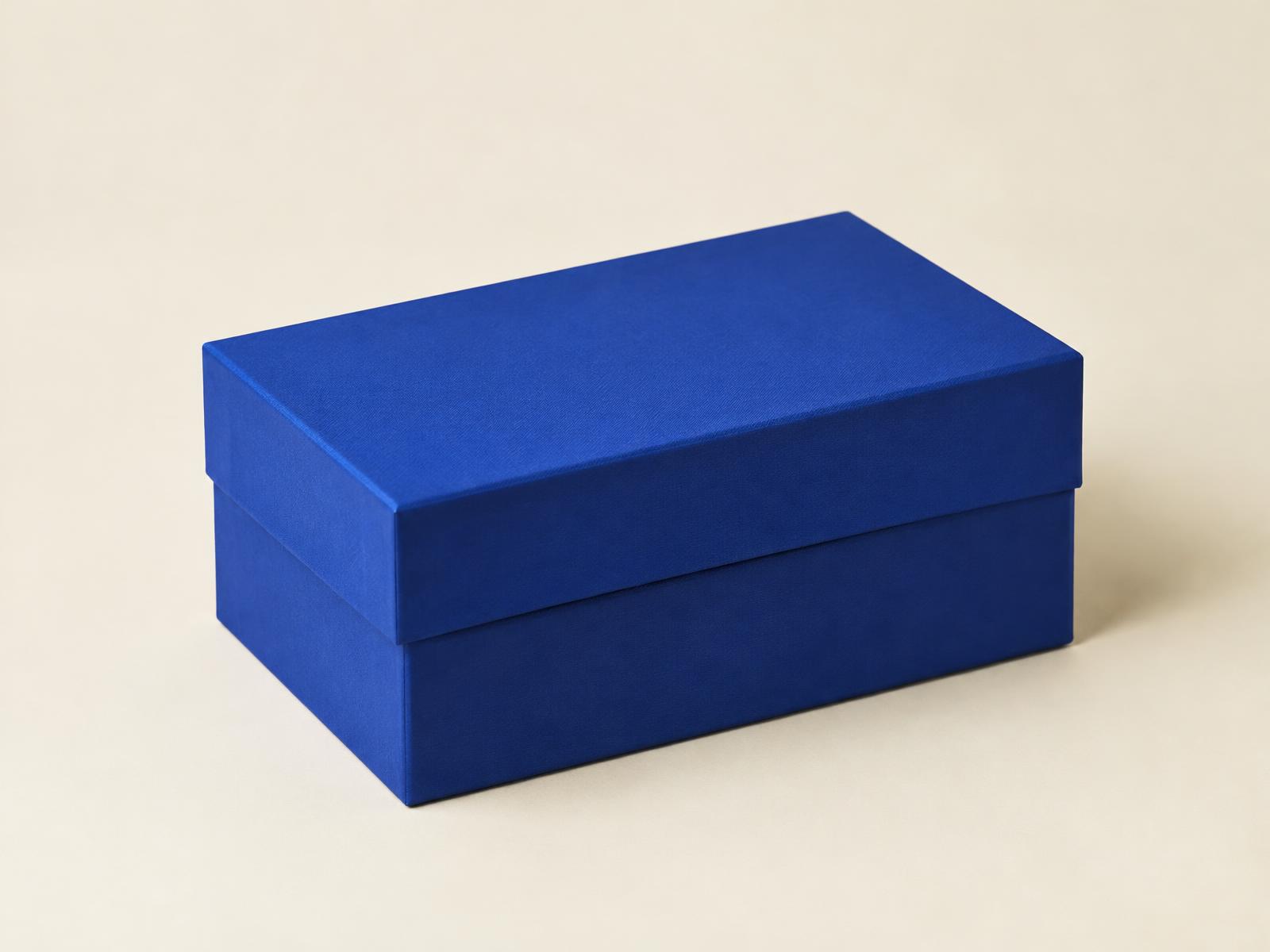 Rigid two-piece box with a textured warm-white wrap
